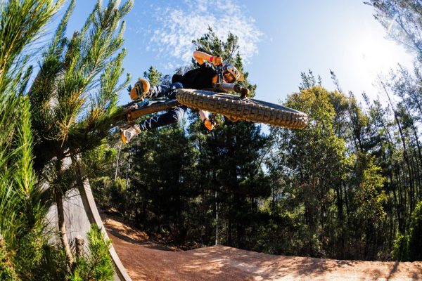 Mountain bike rider jumping on wall ride at mystic bike park bright victoria