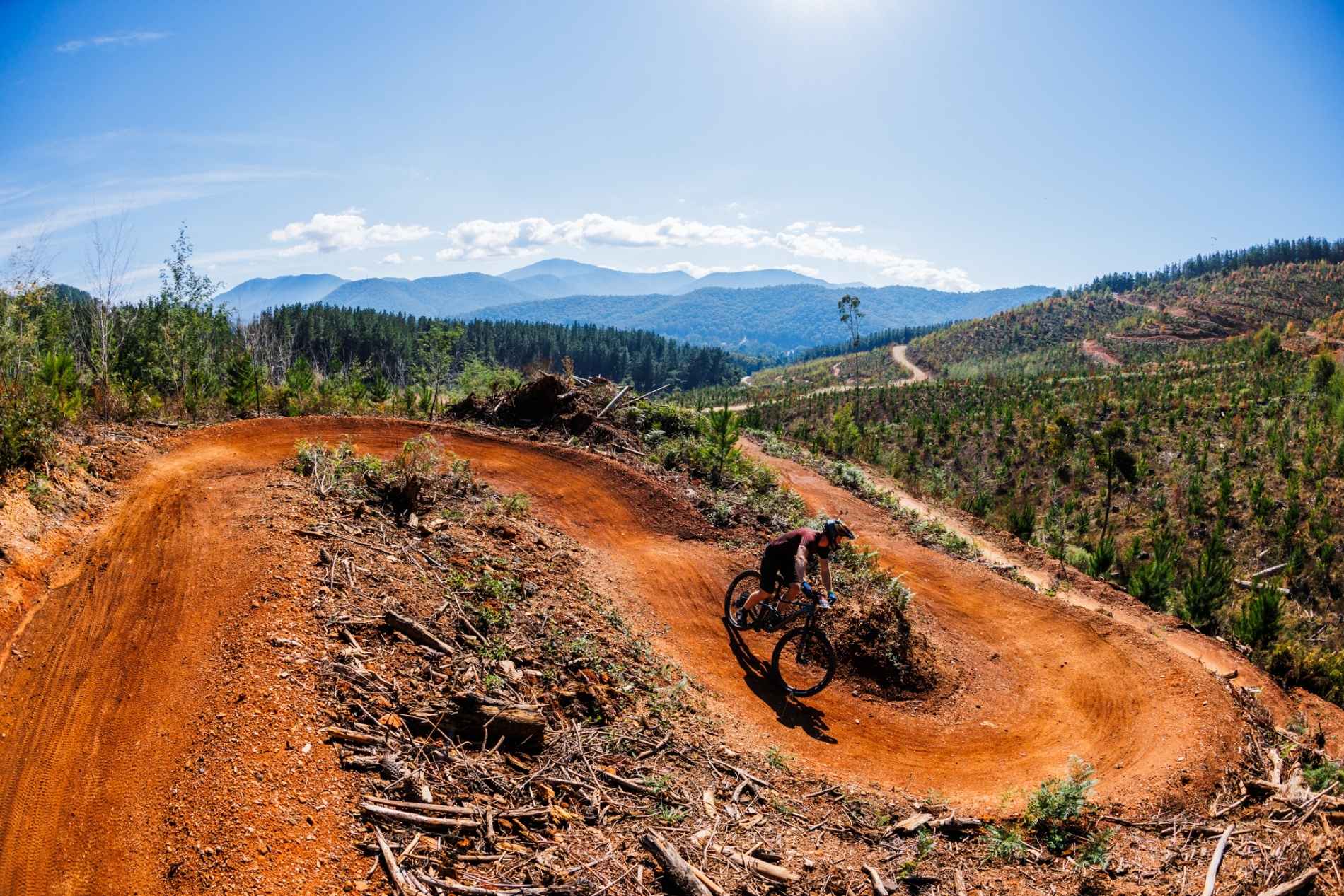 Rider in mountains on trail bike at mystic bike park bright victoria