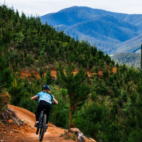Rider in amongst mountains riding a bicycle