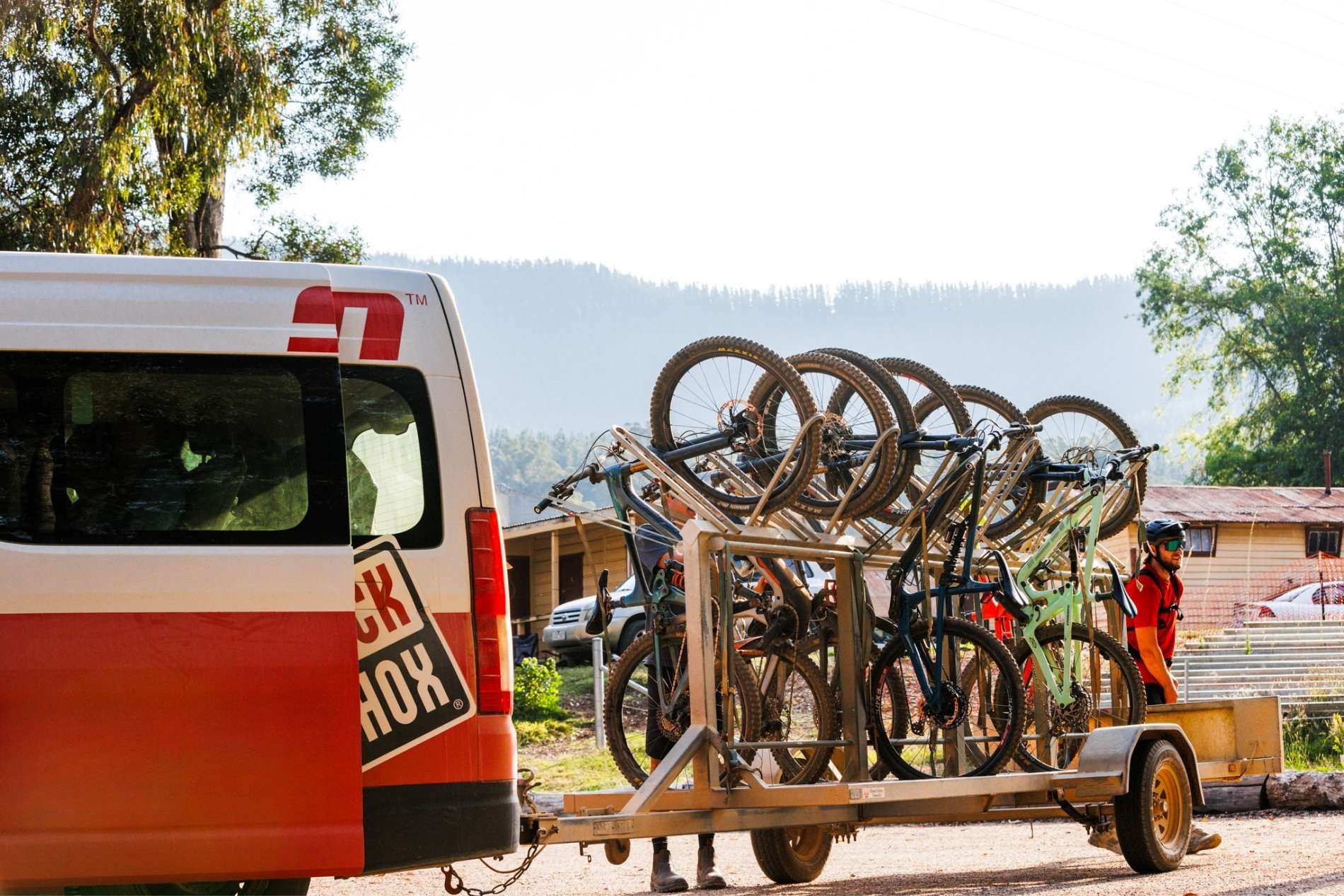 A vehicle with trail carrying bicycles at Mystic bike Park in Bright