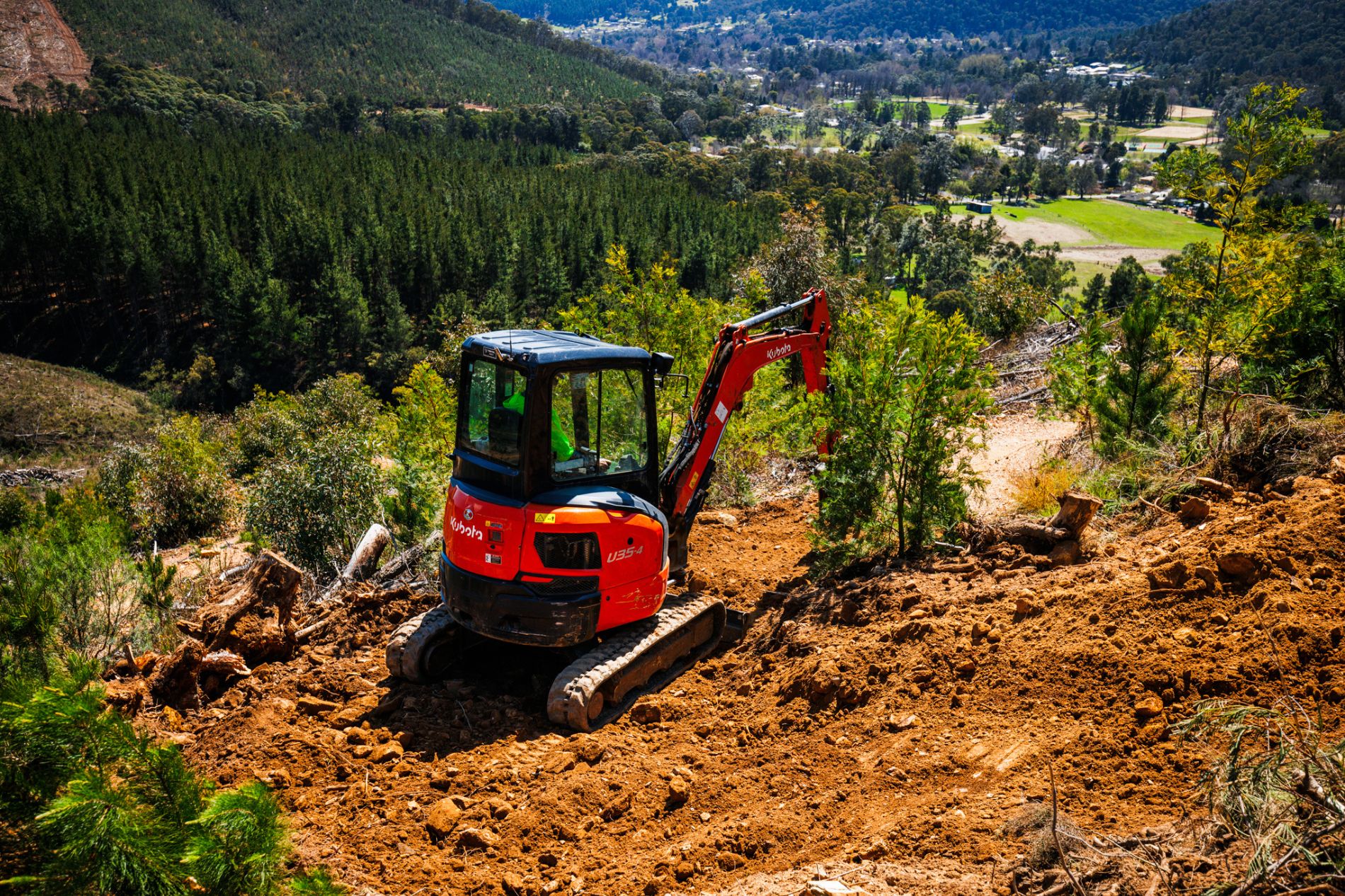 Excavator in Bike Park building new MTB trails in Bright victoria