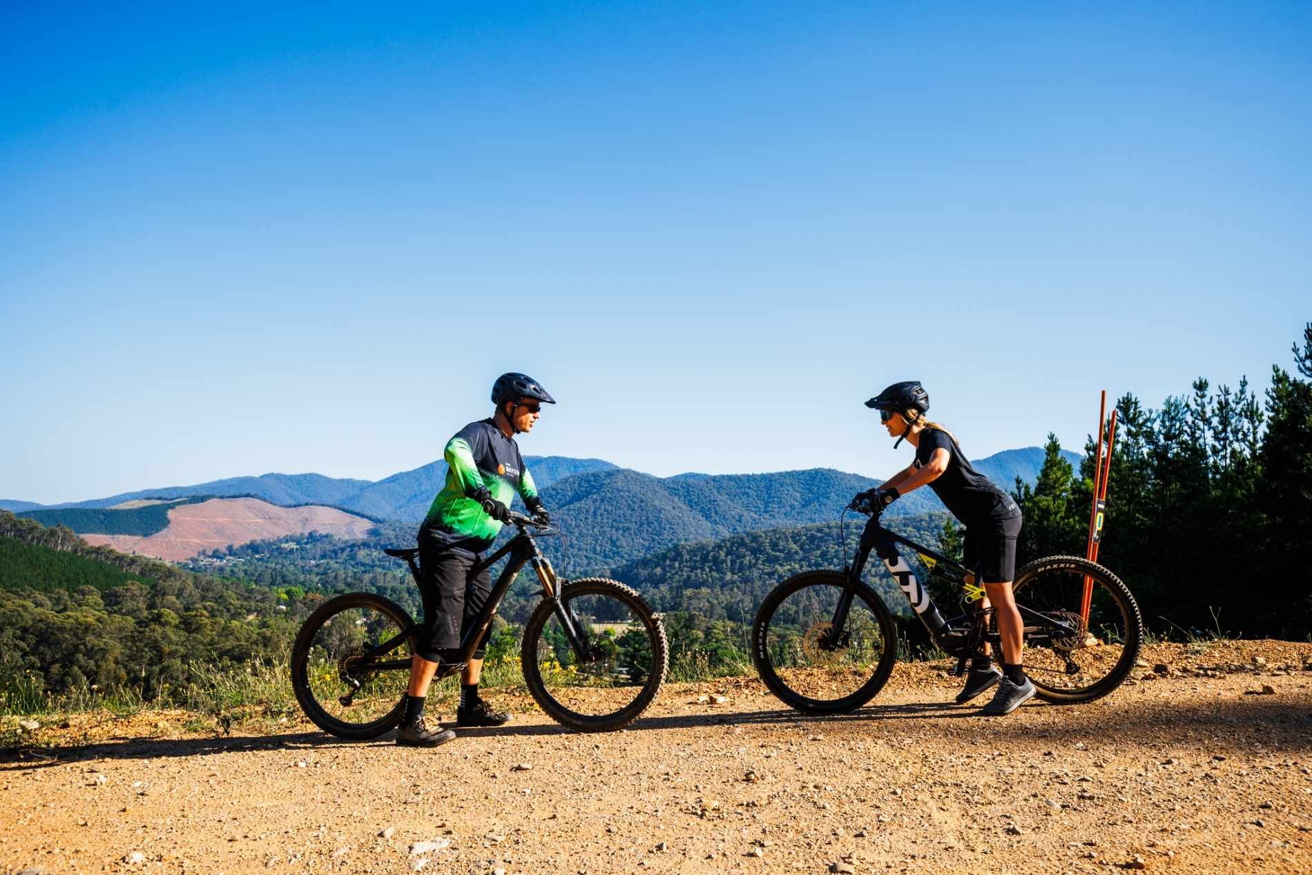 Two riders on a mountain at Mystic Bike Park with Bike Instructor